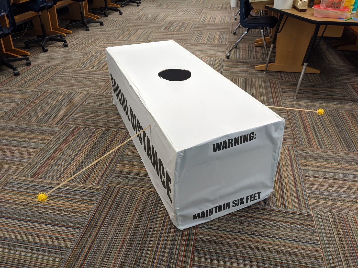 Personal-space bubble box reading 'Warning: Maintain Six Feet'