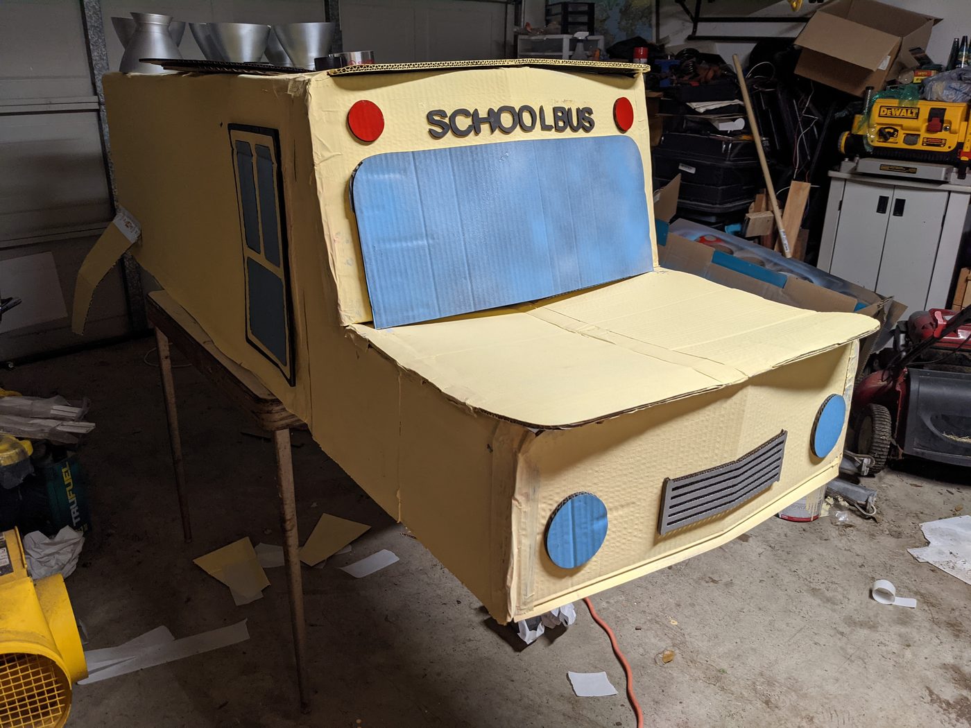 Cardboard Magic School Bus from the side with SCHOOLBUS lettering