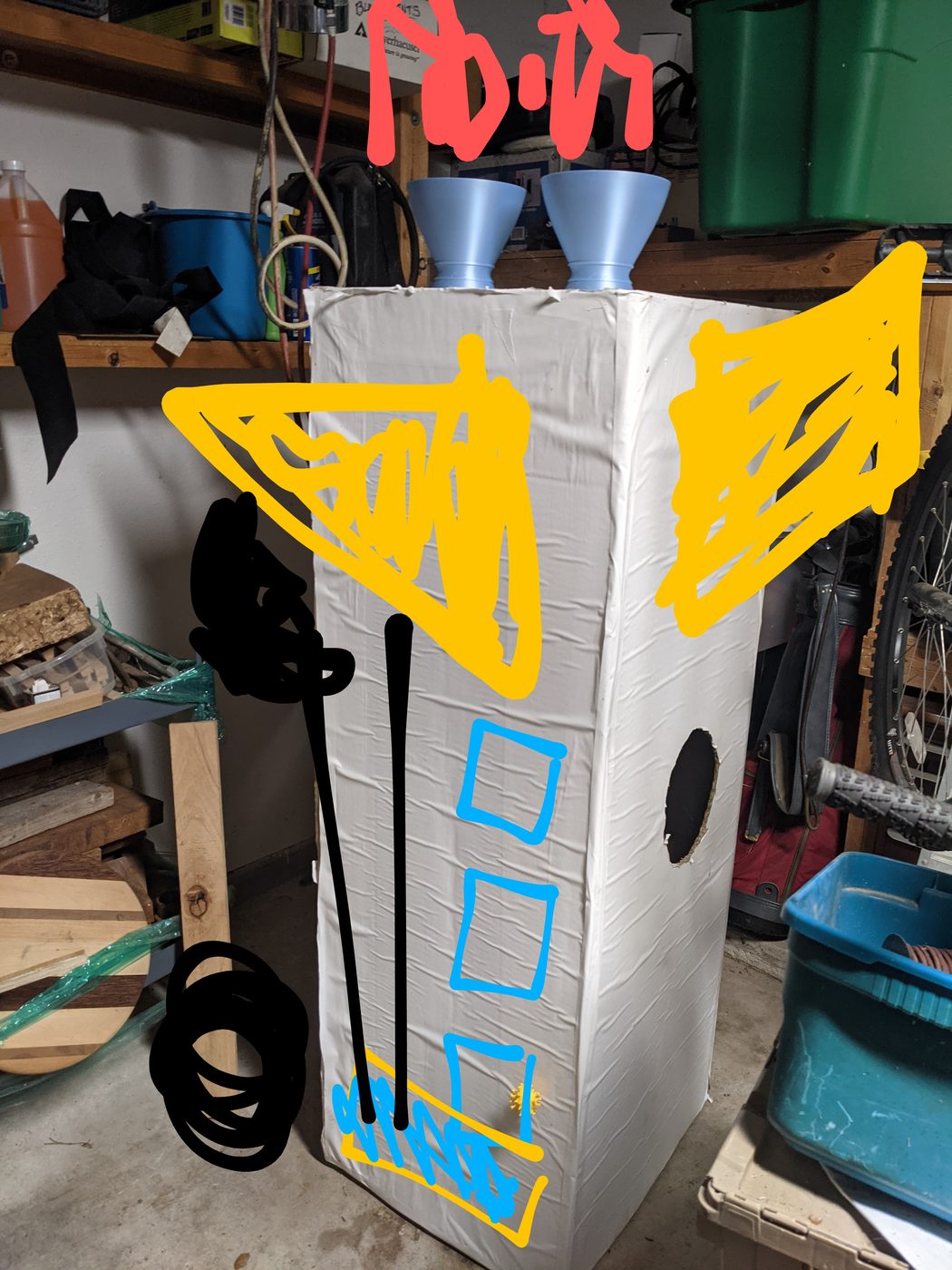 Silver-painted nozzle cones drying on cardboard
