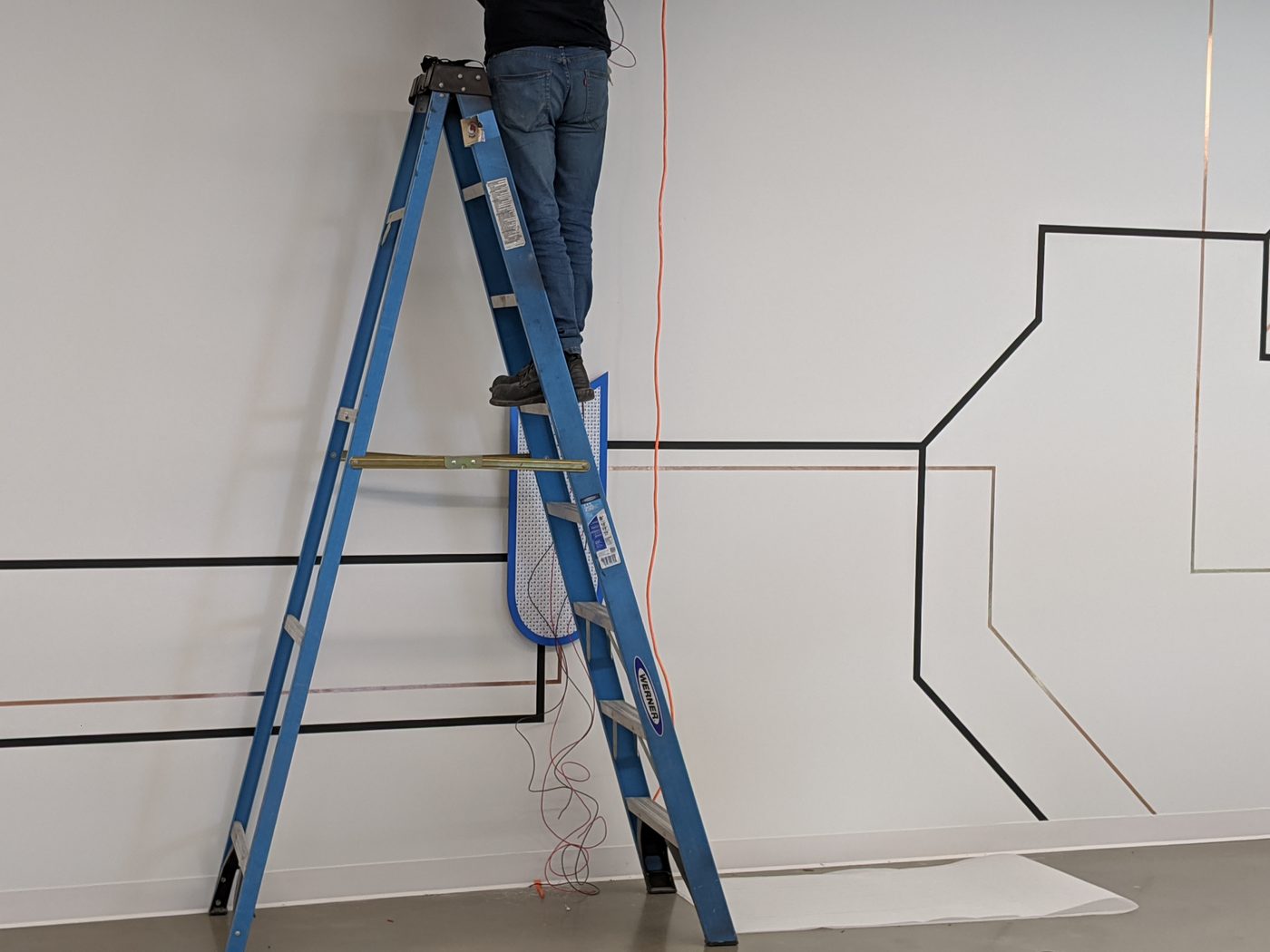 Installing the wall traces from a ladder