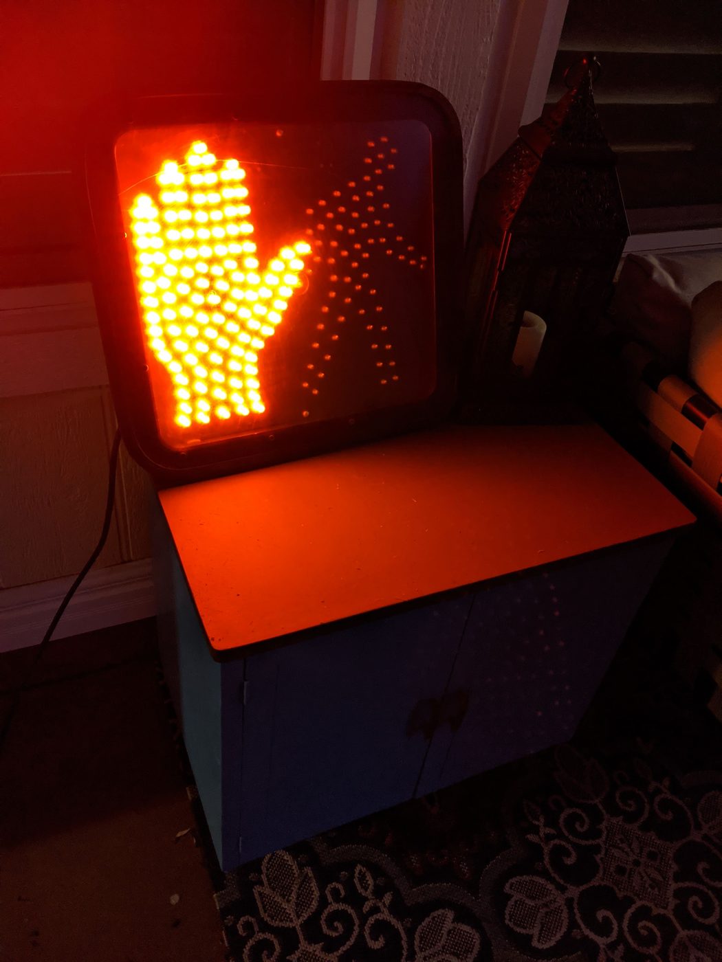 Pedestrian signal lit up with the don't walk hand